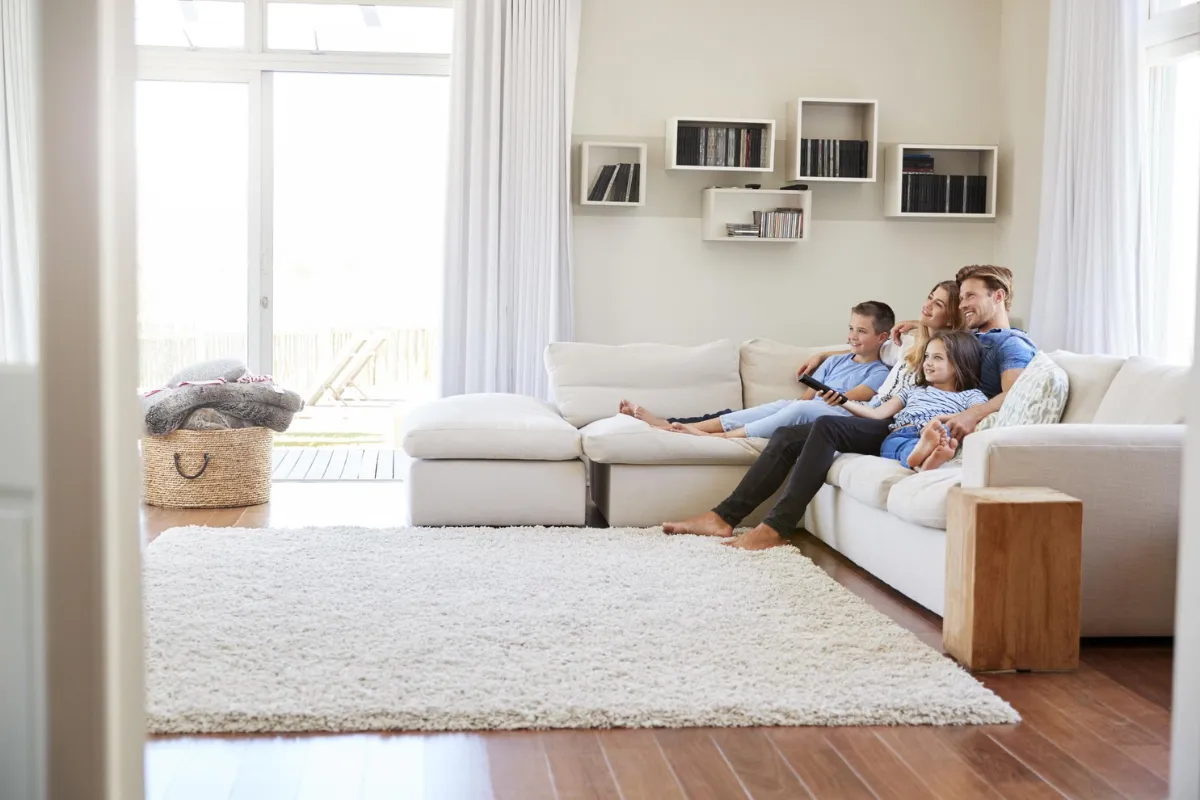 family on the couch watching tv